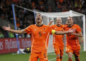 Netherlands' Van Bronckhorst celebrates after scoring a goal during their 2010 World Cup semi-final soccer match against Uruguay in Cape Town